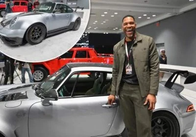 TV star and the former New York Giant Michael Strahan proudly shows his custom-made Porsche at New York Auto Show - Tedson Motors